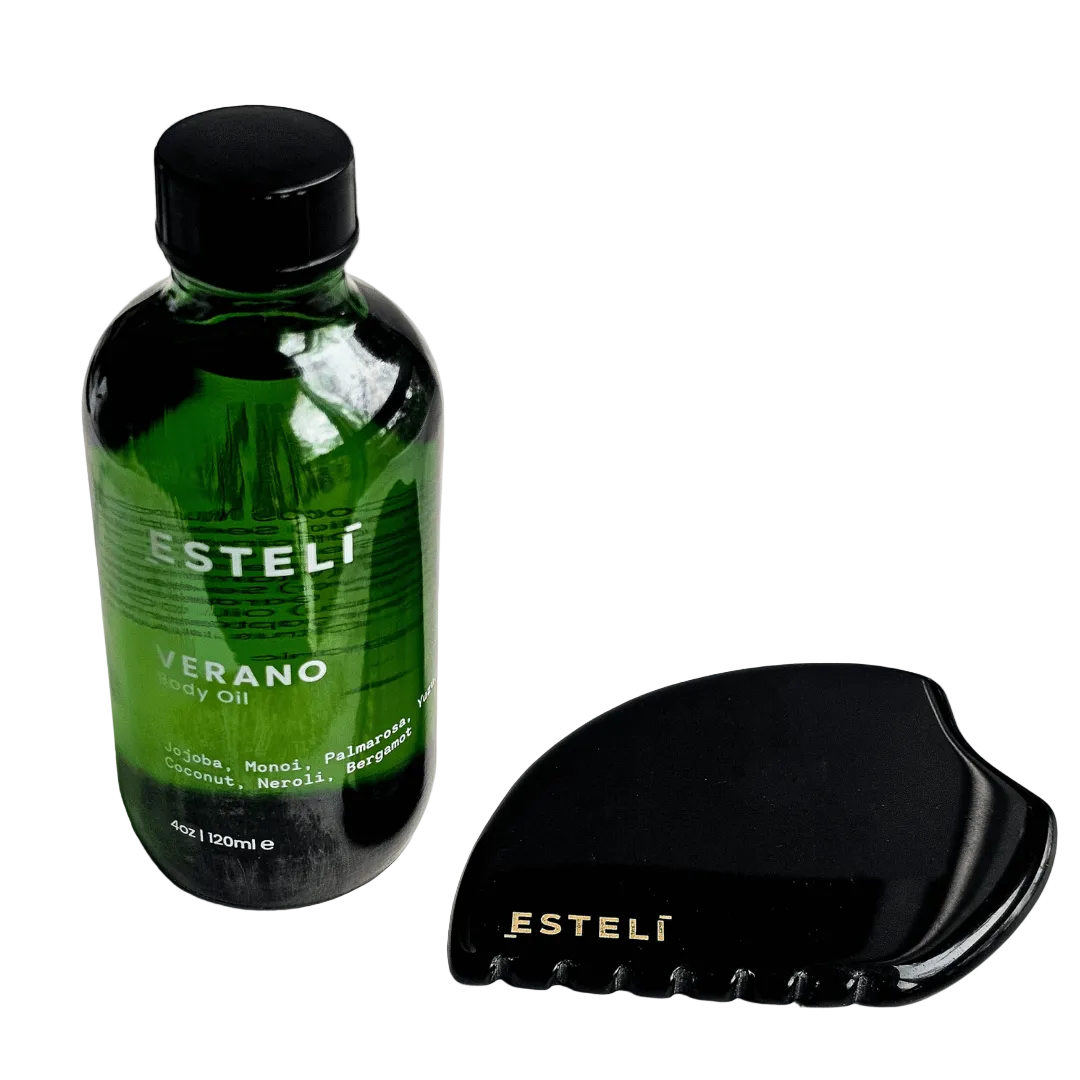 Green bottle and black gua sha tool with 'Esteló' branding on a white background. Obsidian Body Ritual Set, a duo crafted to rejuvenate, nourish, and restore harmony to your skin and spirit.

Obsidian Gua Sha (Face &amp; Body): Hand-carved from volcanic black obsidian, this versatile tool is designed to release tension, improve circulation, and support lymphatic drainage, revealing smoother, firmer skin with each use.
Verano Body Oil: A sumptuous blend of nutrient-rich botanicals, this lightweight oil deepl