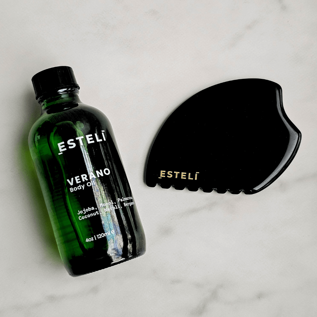 Estelé body oil bottle and black grooming tool on a light background. Obsidian Body Ritual Set, a duo crafted to rejuvenate, nourish, and restore harmony to your skin and spirit.

Obsidian Gua Sha (Face &amp; Body): Hand-carved from volcanic black obsidian, this versatile tool is designed to release tension, improve circulation, and support lymphatic drainage, revealing smoother, firmer skin with each use.
Verano Body Oil: A sumptuous blend of nutrient-rich botanicals, this lightweight oil deeply hydrates, 