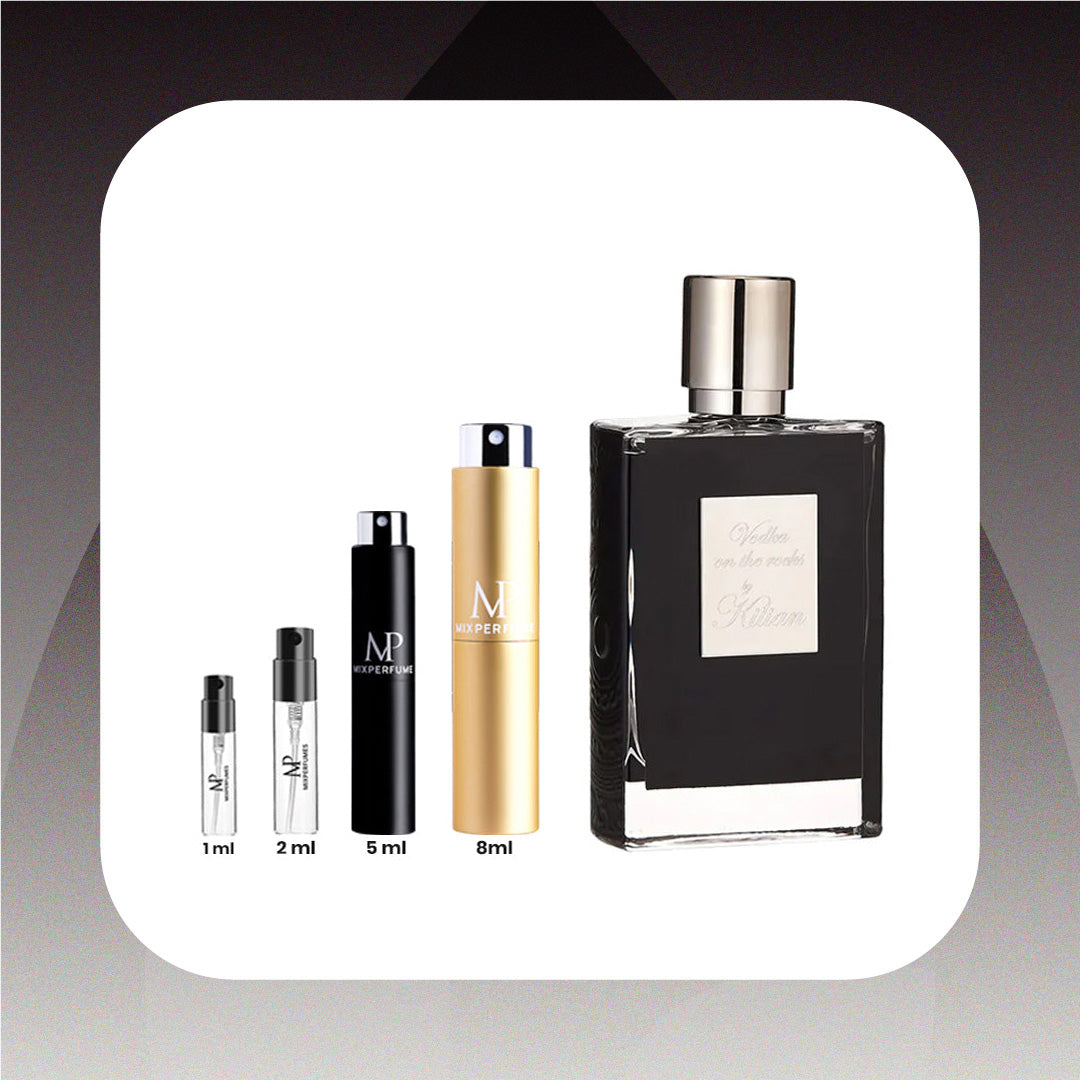 Collection of perfume bottles with varying sizes on a gradient background