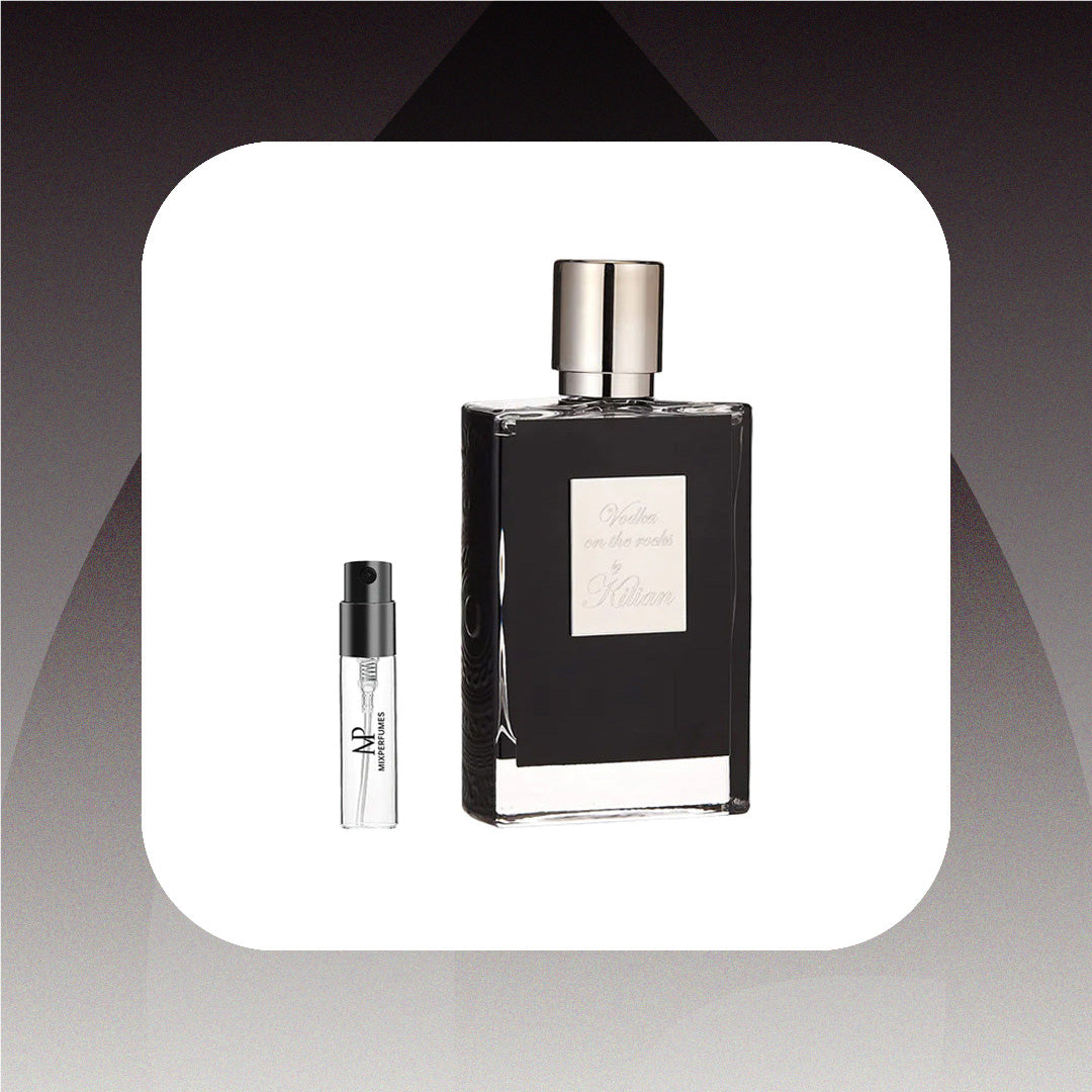 Black perfume bottle with silver cap and smaller clear bottle on a gradient background