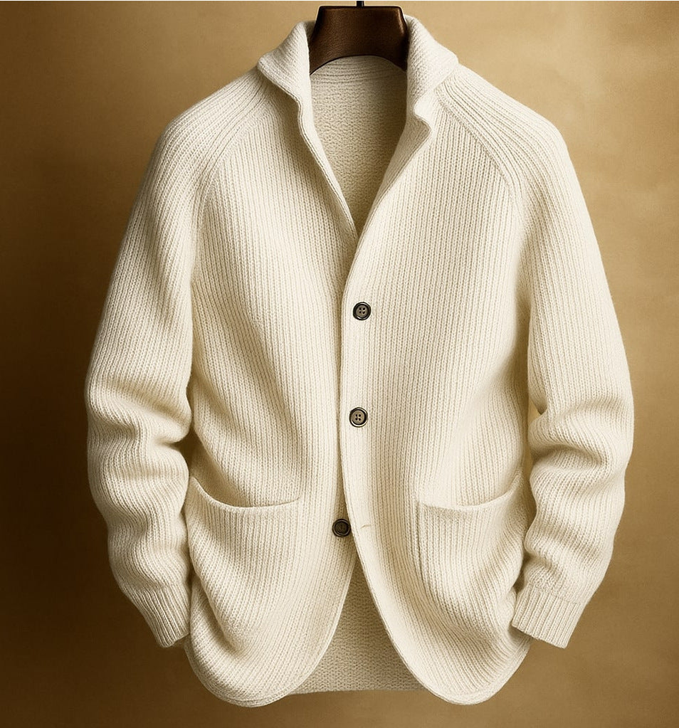 White knitted cardigan on a brown background