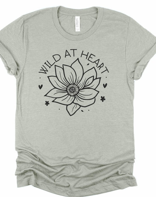 Gray women's short-sleeve graphic t-shirt featuring a black floral line-art design with the words "Wild at Heart" arched above the flower, displayed on a white background.