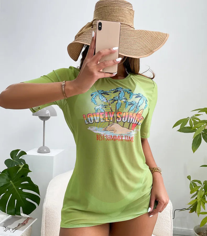 Person wearing a green t-shirt with a 'Lovely Summer Best Summer Time" graphic on a light background. Women's Black Split Swimsuit Bikini Featuring Polyester Fabric with Printing, Perfect for Swimming Pool