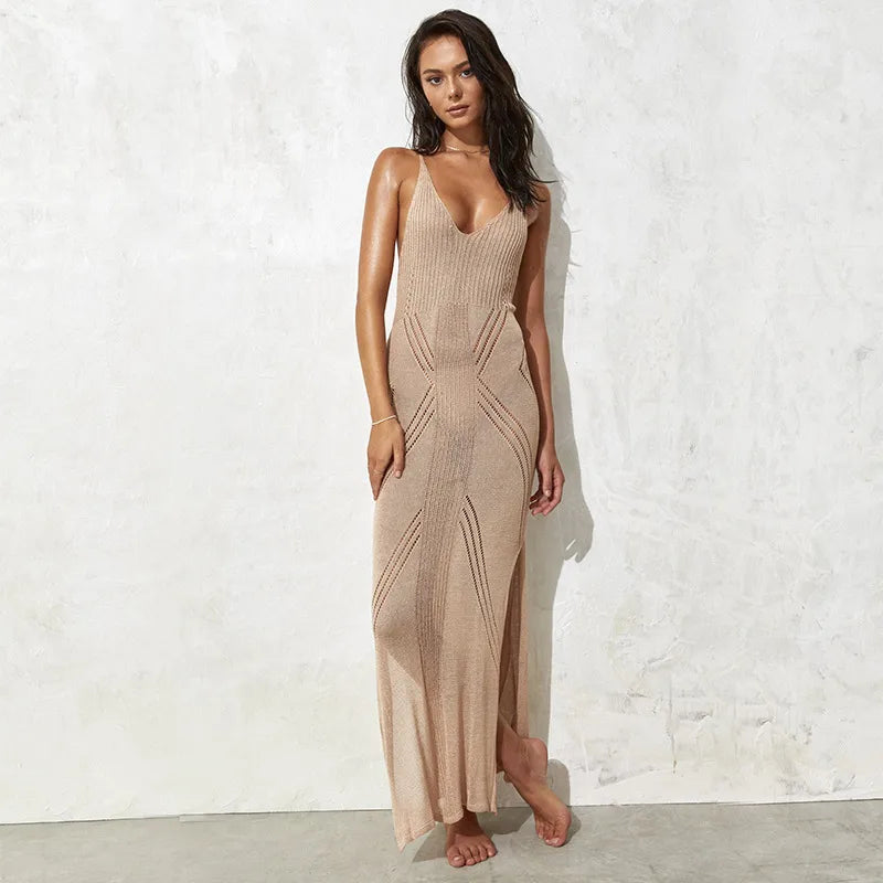 Woman wearing a beige sleeveless dress against a white wall beach cover up, maxi beach dress, swimsuit cover up, beach sundress, maxi sundress, women's beachwear, resort wear, vacation dress, beach dress, poolside cover up, sleeveless dress, scoop neck dress, high waist dress, summer dress, tropical vacation outfit, cruise wear, beach vacation dress, resort dress, swim cover up, lightweight dress, vacation clothing, coastal style dress, boho beach dress, women's resort wear, flowy maxi dress, beach fashion,