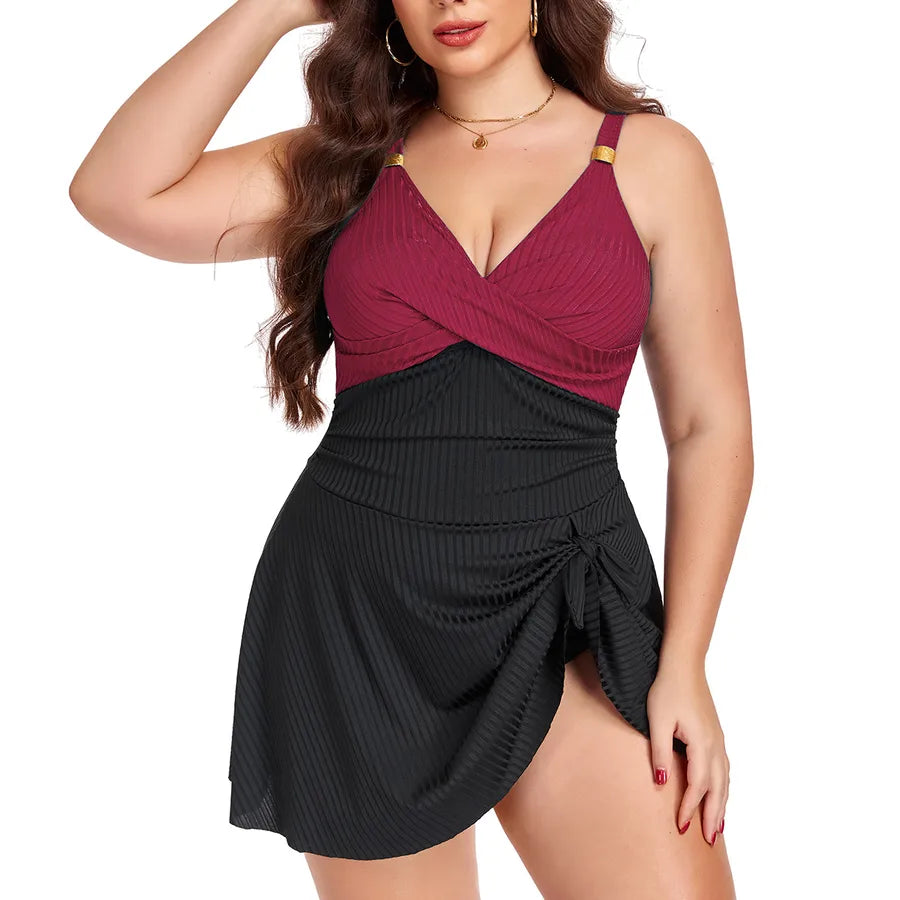 Woman wearing a two-tone dress with a red top and black skirt on a white background Women's Plus Size One-Piece Swimsuit – Elegant Solid Color Swimwear ( L–5XL Sizes )