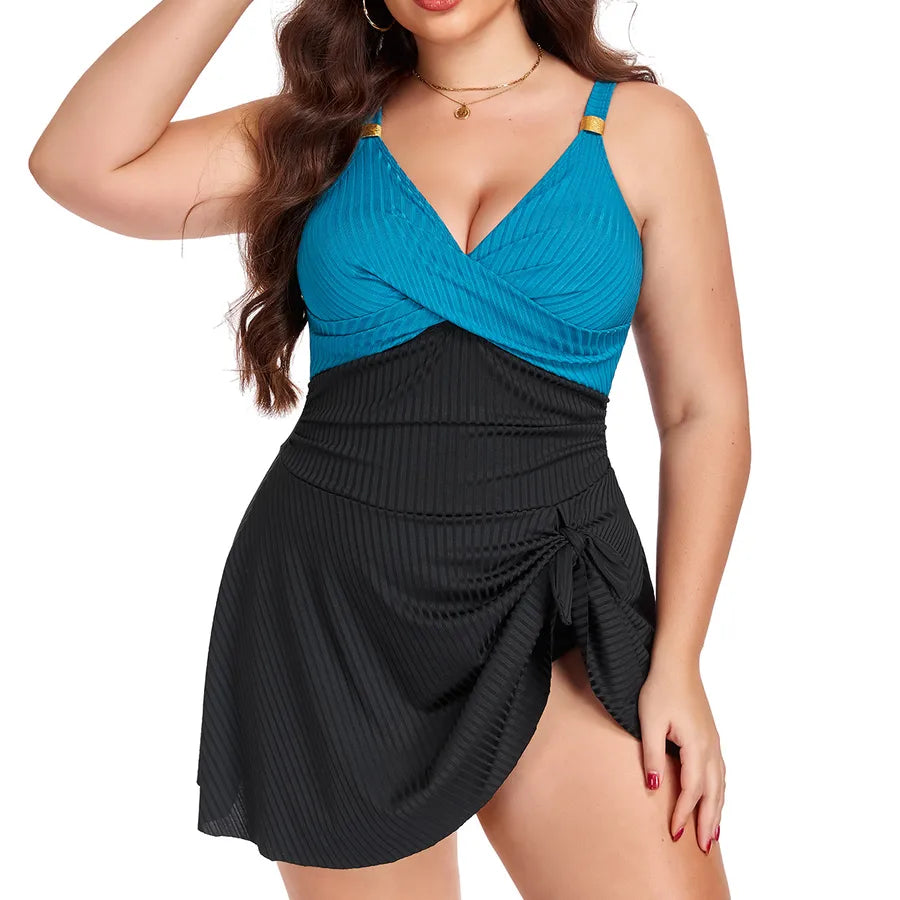 Woman wearing a two-tone blue and black dress on a white background Women's Plus Size One-Piece Swimsuit – Elegant Solid Color Swimwear ( L–5XL Sizes )