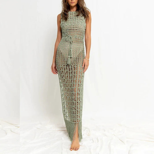 Woman wearing a green crochet dress on a white background beach cover up, crochet beach cover up, crochet dress, beach cover up dress, sleeveless cover up, swimsuit cover up, bikini cover up, resort wear, resort cover up, vacation cover up, beachwear women, women's beachwear, maxi cover up, long beach dress, crochet beach dress, knit cover up, open knit dress, boho beachwear, bohemian cover up, tropical vacation outfit, cruise wear, poolside cover up, luxury resort wear, vacation essentials, summer beach