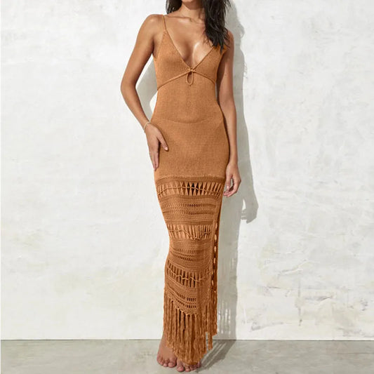 Woman wearing a brown crochet dress against a white wall women's beach cover up, resort wear women, swimsuit cover up women, maxi beach dress, luxury beachwear, vacation clothes for women, beach vacation outfit, tropical resort wear, cruise vacation dress, poolside cover up dress, elegant beach cover up, summer travel clothing, coastal chic fashion, lightweight resort dress, beach club cover up, island getaway outfit, vacation essentials women, women's vacation wardrobe, stylish swim cover up, resort chic