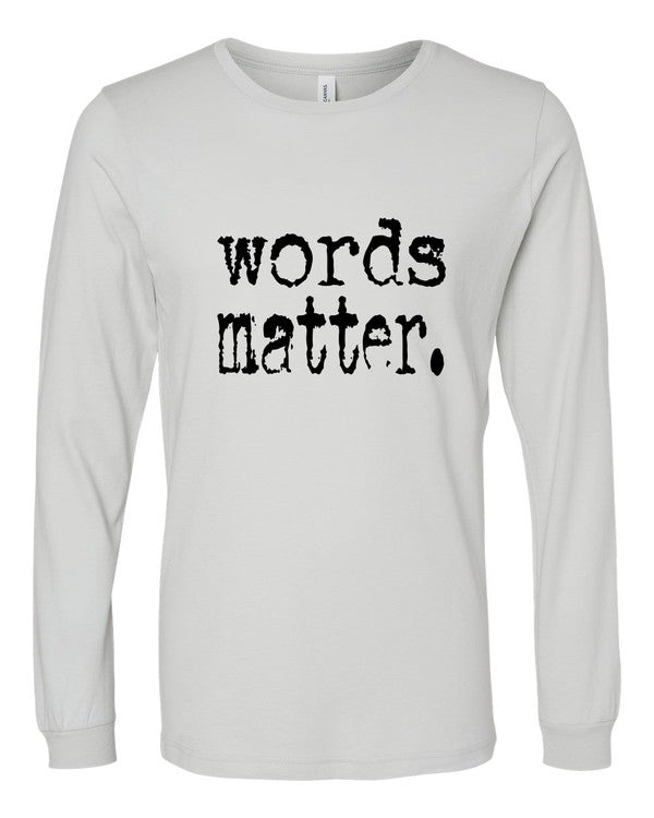 Cream long sleeve graphic tee featuring distressed black "words matter." text across the front, displayed flat on a white background.