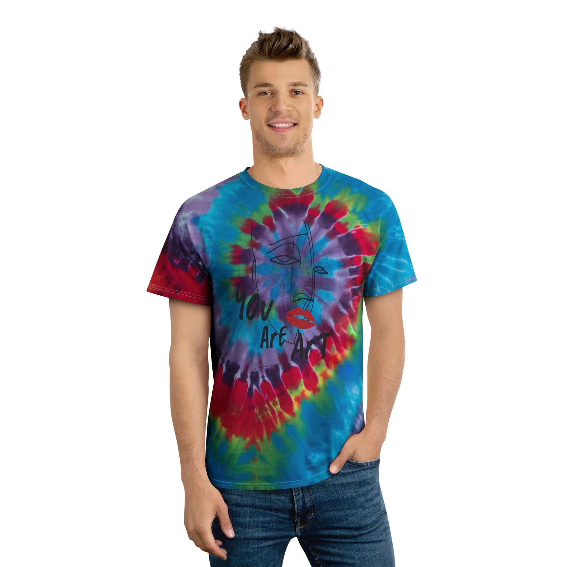 Man wearing a colorful spiral tie-dye t-shirt featuring a minimalist "You Are Art" face graphic on a white background. Unisex casual summer tee with vibrant rainbow colors, perfect for festivals, beach trips, concerts, gifts, and everyday wear.