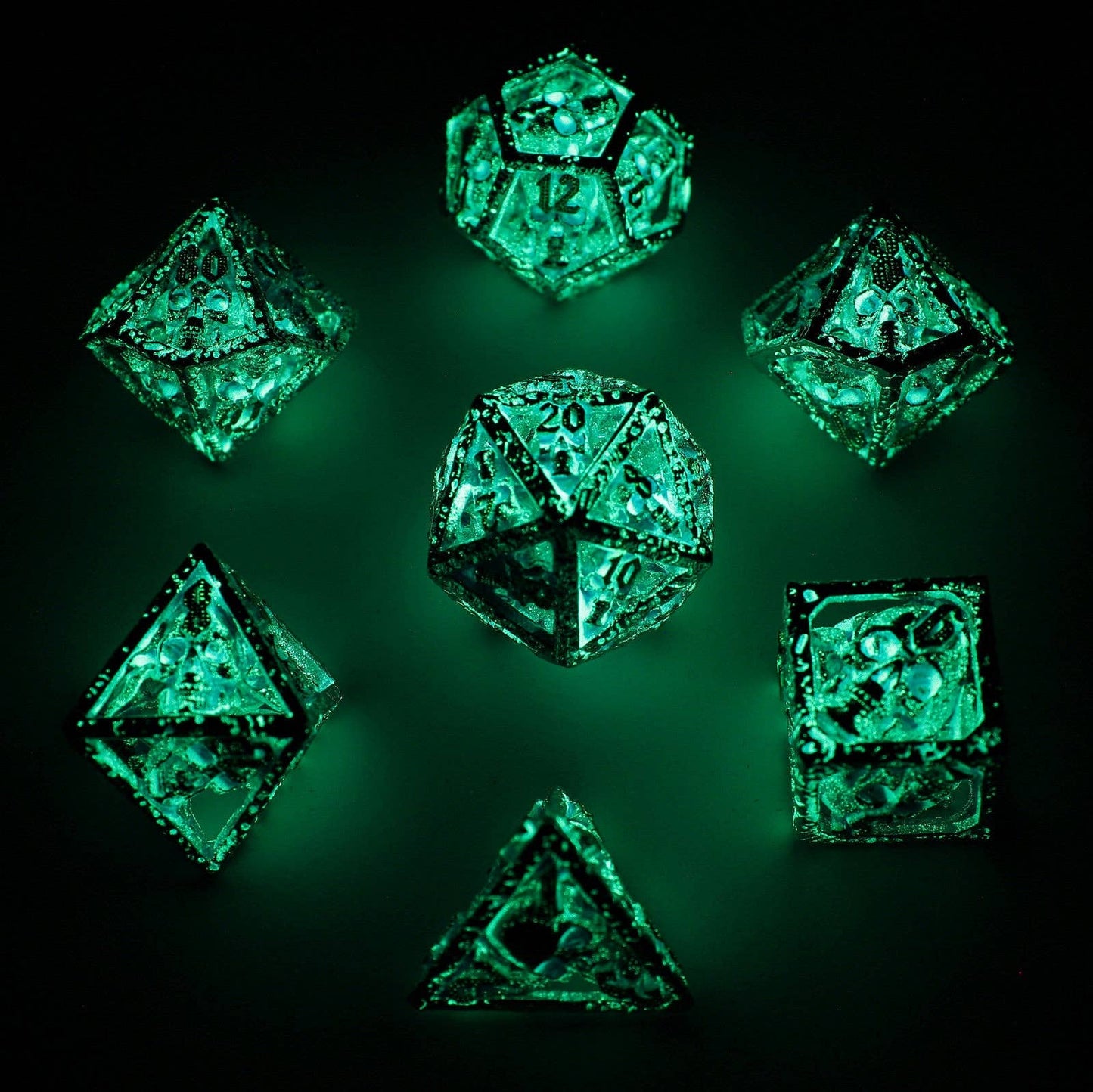 Skull's Grin Hollow Metal Dice Set - Glow in the Dark Blue