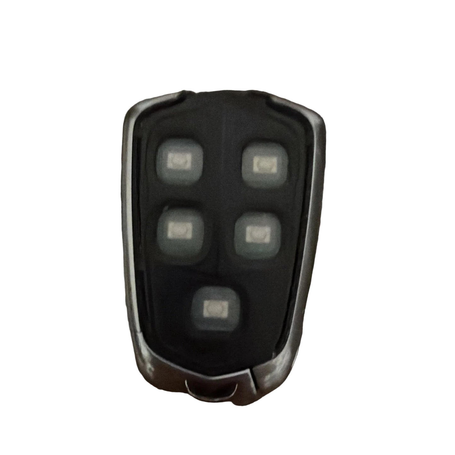 Black and silver remote control on a textured brown surface