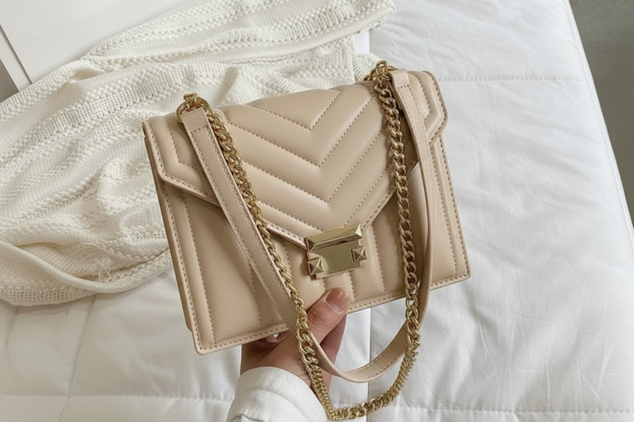 beige light tan shoulder bag with gold chain beige light tan shoulder bag with gold chain