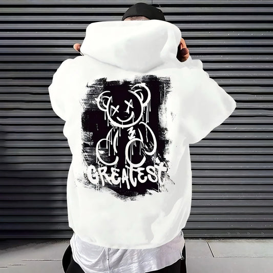 Person wearing a white hoodie with a dripping bear graphic design on the back, standing in front of a metallic shutter.