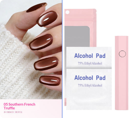 A hand with glossy brown manicured nails wearing a metallic brown nail polish, shown beside product packaging and accessories: two white alcohol pad packets labeled 75% Ethyl Alcohol and a pink nail file or buffer block. Text at lower left reads '05 Southern French Truffle'.