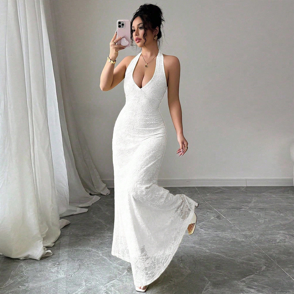 Bare your shoulders and own the room in this cheeky bareback and halter neck lace dress that's pure sophistication with a flirty twist. The plunging V-neckline and sleeveless cut let your skin shine, while the graceful A-line silhouette flatters every figure from mid-waist to floor. Crafted in delicate lace over polyester, it's breathable, comfortable, and undeniably gorgeous. The easy pullover closure means less fussing, more fabulous. 