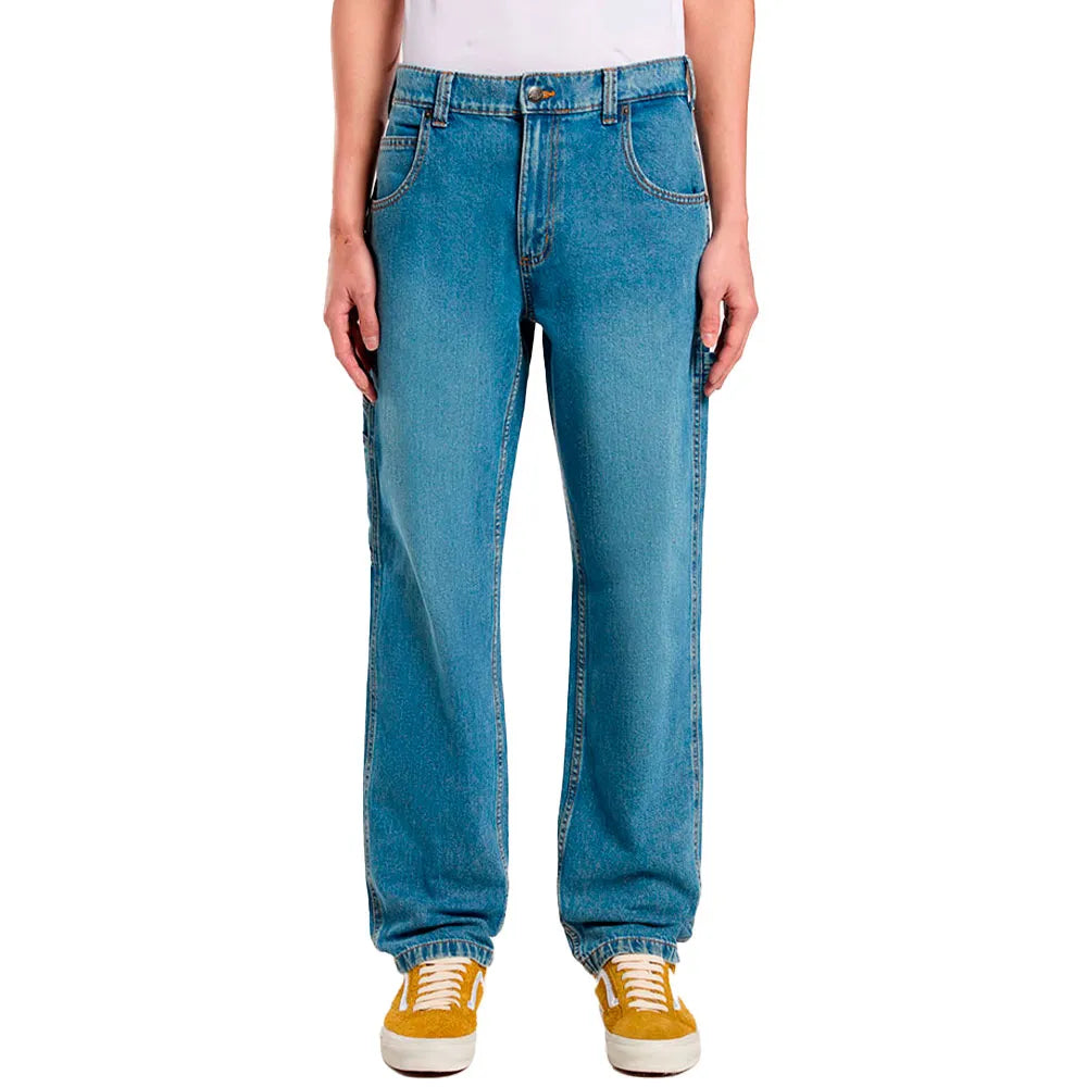 Blue jeans worn by a person on a white background