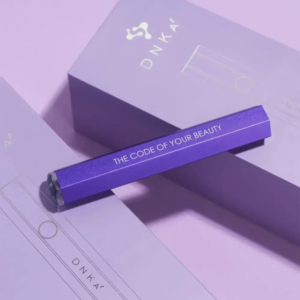 DNKa Lumos Light UV/LED flashlight in purple, displayed against a matching purple background.