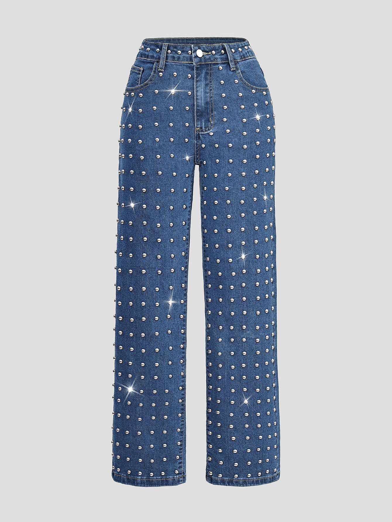 Blue jeans with sparkling embellishments on a light gray background