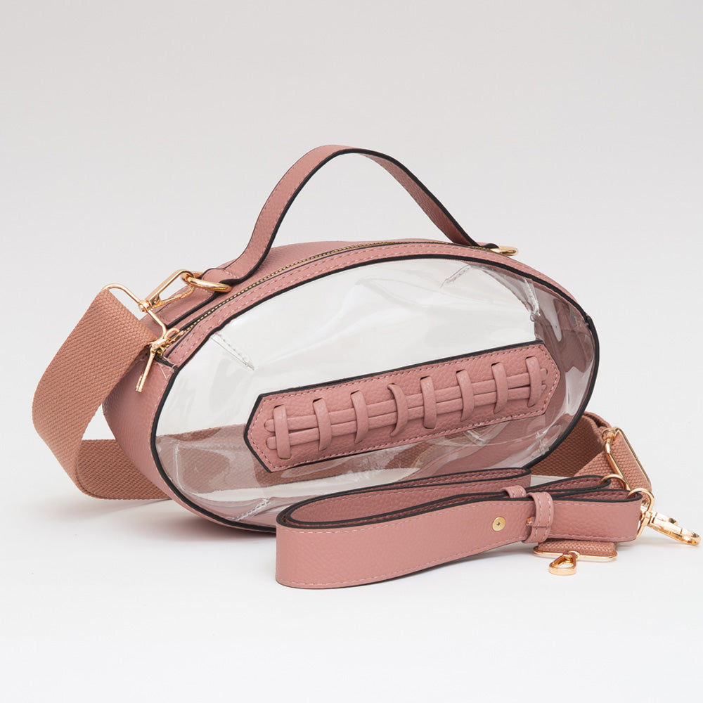 Pink clear transparent bag with gold accents on a light gray background