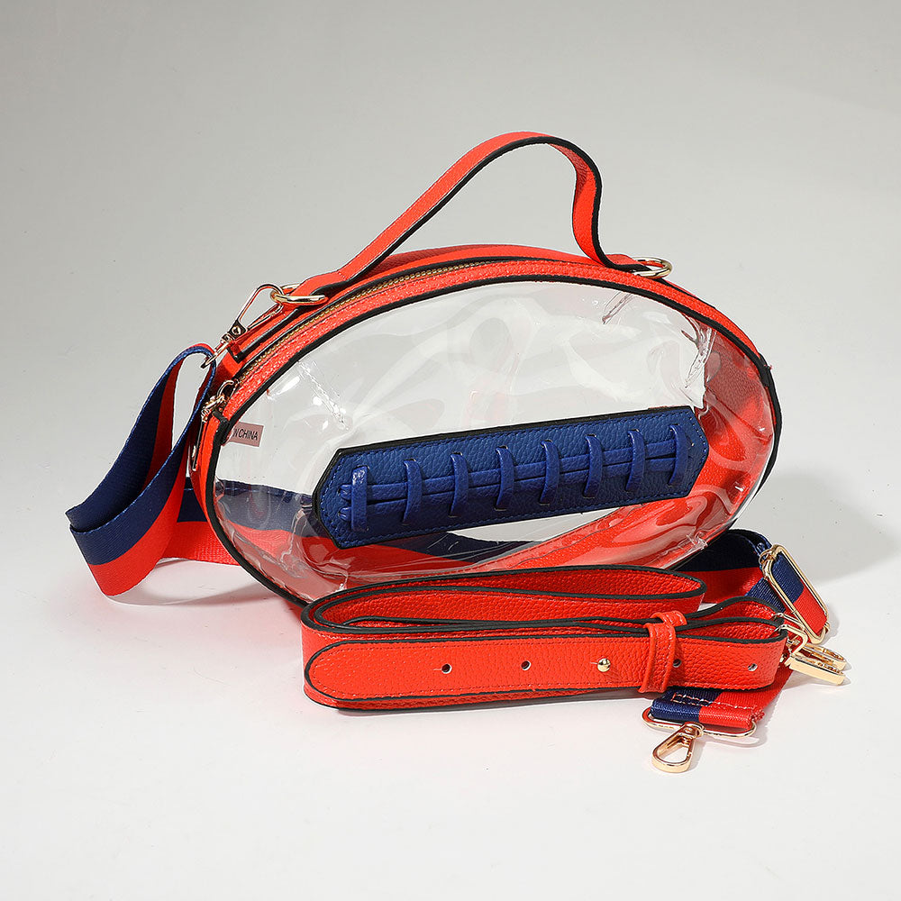 Red and clear handbag with blue interior on a light gray background