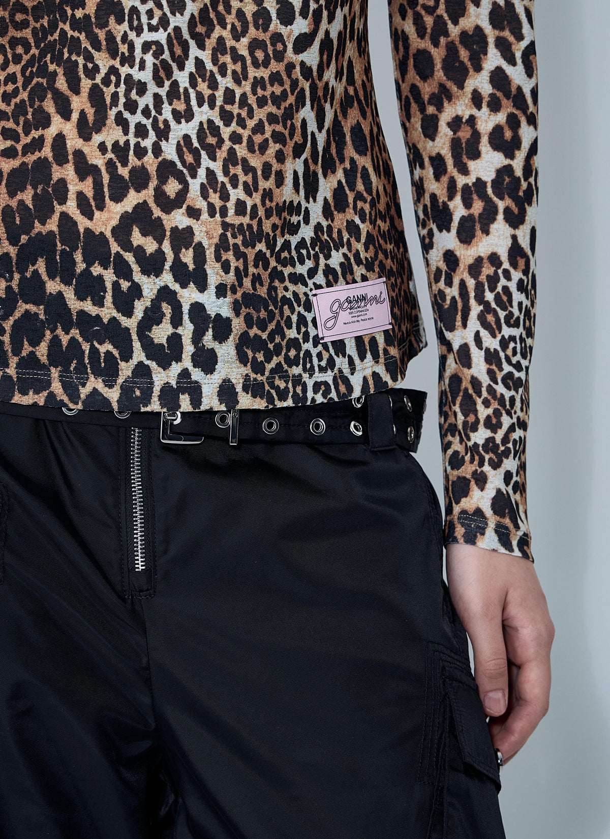 GANNI women's brown mesh long-sleeve crewneck top featuring an all-over abstract print and a branded logo patch on the front.
