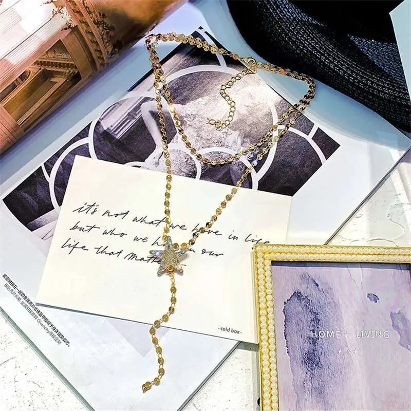 Gold Star Crystal Pendant Necklace variable mso-font-signature