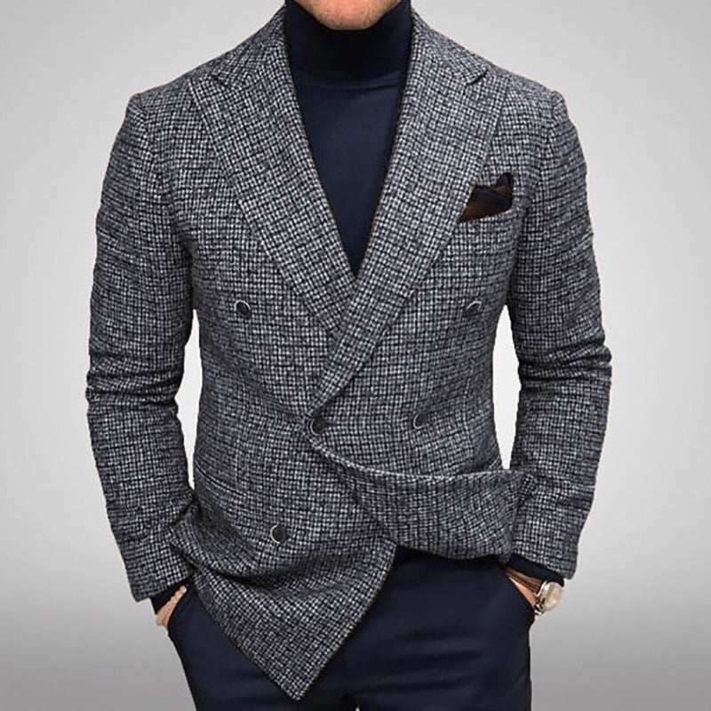 Gray houndstooth patterned blazer worn by a person on a gray Make a statement with this sharp men's plaid blazer that's anything but boring. Designed with a contemporary slim fit and double-breasted front, this jacket brings effortless style to your everyday rotation. The premium polyester knit fabric feels as good as it looks—soft, breathable, and built to last. Rock it in timeless gray or rich brown, and choose your perfect fit from S to XXXL. Long sleeves, practical side pockets
