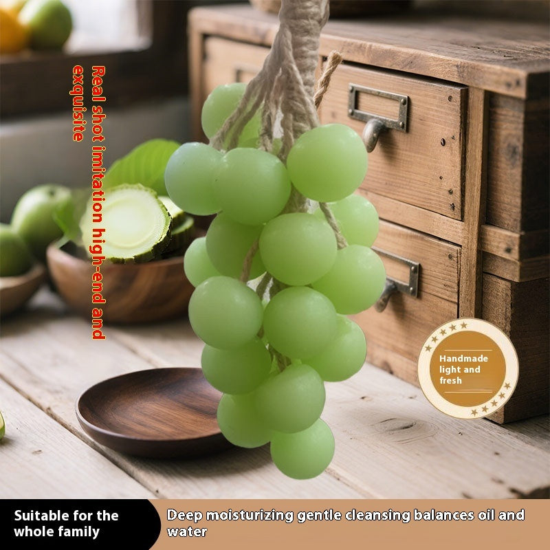 Bunch of green grapes on a wooden surface with a rustic background
