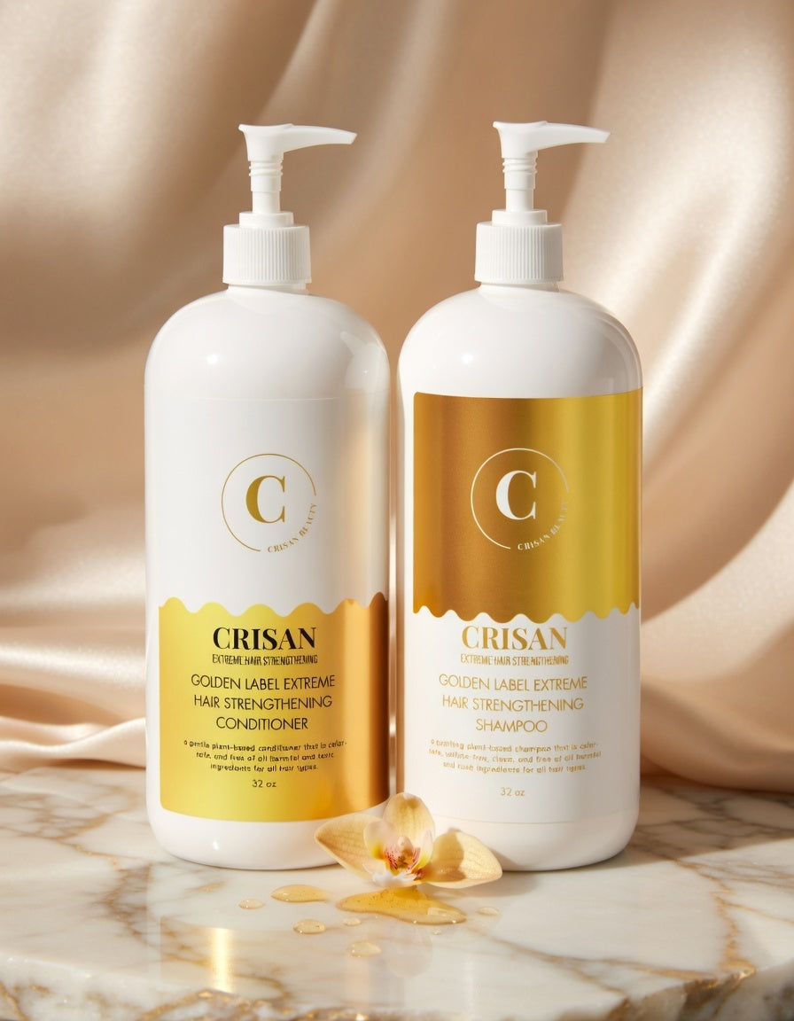 Two bottles of Crisan hair care products on a marble surface with a beige background.