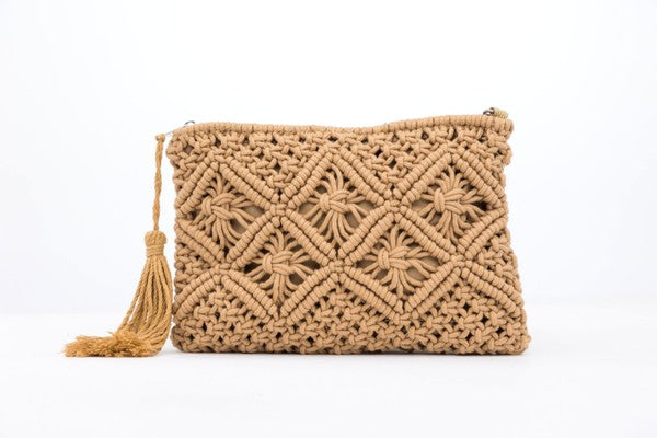 This charming macramé clutch features intricate woven detailing, a lined interior that protects your items, and a hidden open pocket Carry your essentials in soft boho-chic style. This charming macramé clutch features intricate woven detailing, a lined interior that protects your items, and a hidden open pocket for the little things. Finished with a zip closure and a playful tassel accent—perfect for nights out or travel days.

Macrame Tassel Clutch