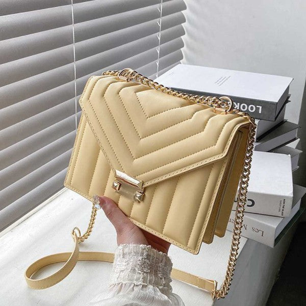 light yellow beige light tan shoulder bag with gold chain