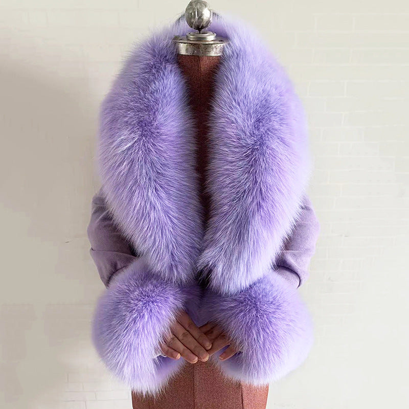 Purple fur stole on a mannequin against a plain background