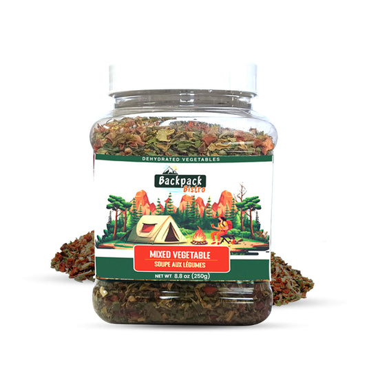 Backpack Bistro Dehydrated Mixed Vegetables in a clear 7.05 oz (200 g) jar filled with dehydrated carrots, spinach, cabbage, onion, and garlic flakes, displayed on a white background with a camping-themed label for soups, stews, ramen, and outdoor cooking.