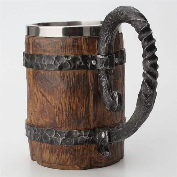 Wooden mug with metal handle and banding on a white background