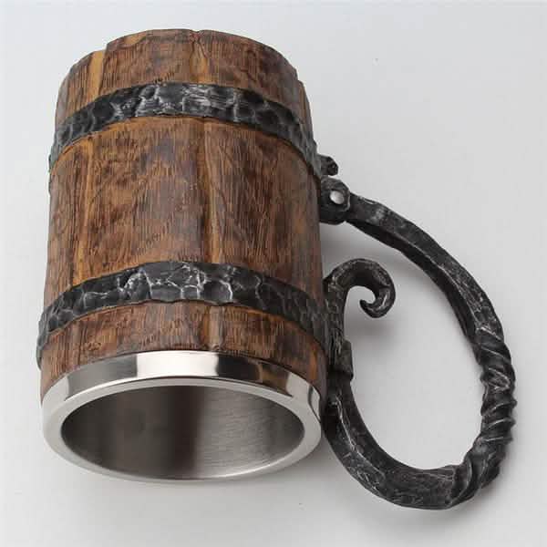 Wooden mug with metal handle and base on a white background