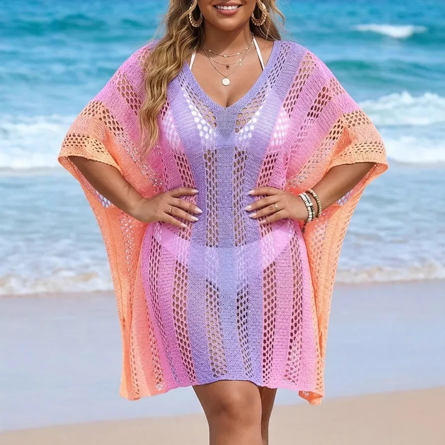 Woman wearing a colorful crochet cover-up on a beach