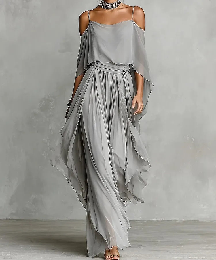 Elegant light gray chiffon two-piece women's co-ord set with asymmetrical cold shoulder camisole top and flowing wide leg pants, resort wear, beach vacation outfit, formal evening fashion, boutique women's clothing.