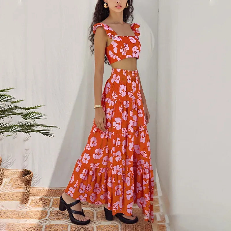Orange floral two-piece maxi skirt set for women with ruffle sleeve crop top, high-waisted tiered long skirt, tropical vacation outfit, beach resort wear, summer matching set, boho floral co-ord outfit, lightweight polyester fashion set