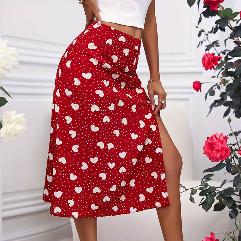 Twirl into elegance with this charming polka dot heart-shaped wrap skirt! Crafted from a comfortable polyester and spandex blend, this mid-length swing skirt features a flattering slit design and playful color-block styling perfect for everyday sophistication. The printed hearts and polka dots add a whimsical touch to your wardrobe, while the wrap silhouette creates a graceful, feminine drape. Available in sizes S M L XL, this versatile piece transitions effortlessly from office to weekend adventures. 