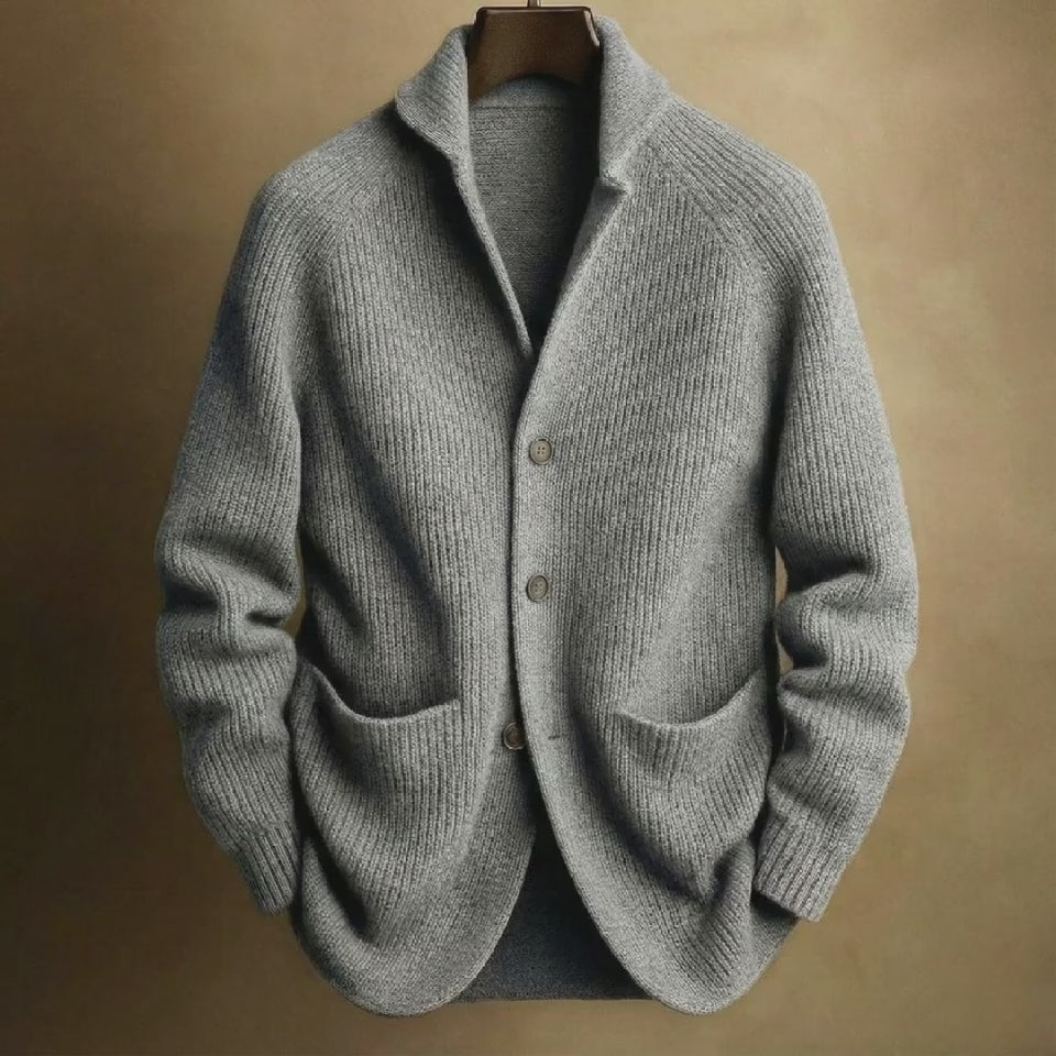 Grey knitted cardigan on a brown background