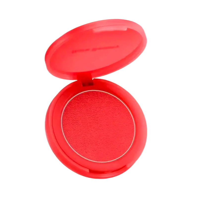 Compact blush in a red case on a beige background