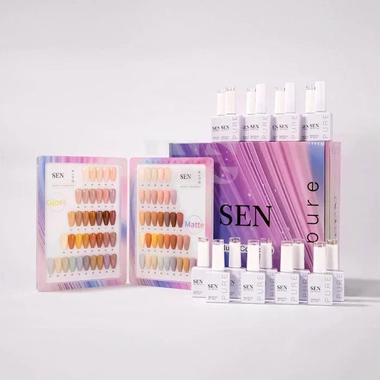 SEN Pure nail polish set with two open color sample trays showing various nude and warm-toned nail colors, several white bottles of polish, and a purple branded box on a clean white background.