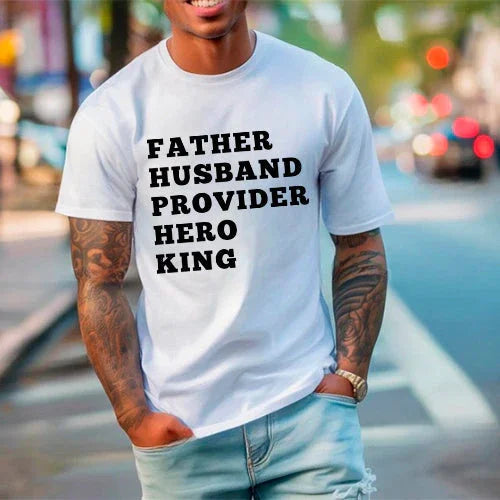 Man wearing a white t-shirt with text on a city street