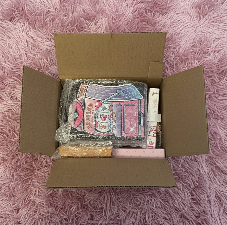 Packaged product in a cardboard box on a concrete surface - MYSTERY BOX FUN BEAUTY BOX