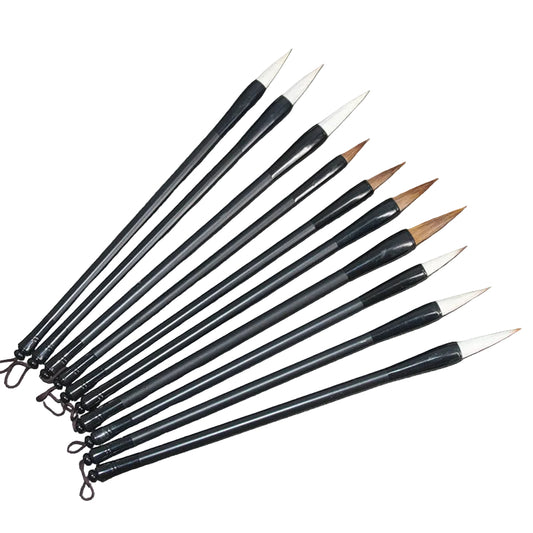 Set of black paintbrushes with white bristles on a wooden surface. Student Wolf Hair Brush, Beginner And Hair Brush