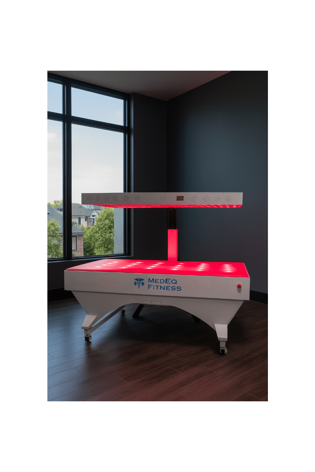 Red and white fitness machine with 'Medeq Fitness' branding in a room with large windows.