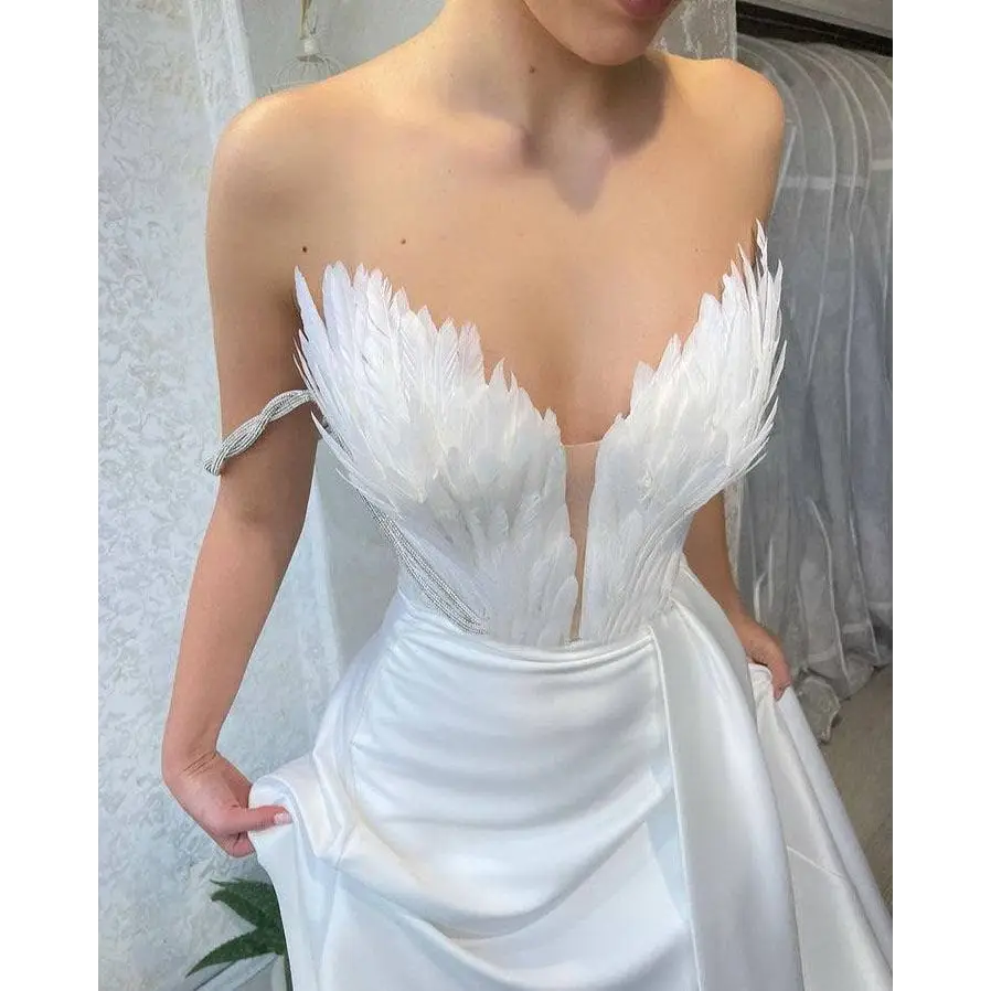 White Satin Gown with Feathers Sweeping the Floor