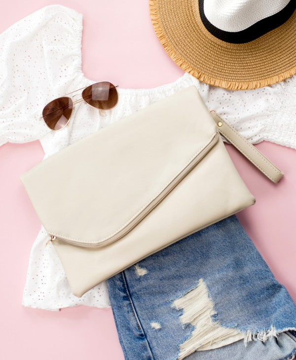 white foldover clutch bag Simple, sleek, and ready for whatever comes next. This oversized foldover envelope clutch is crafted from soft vegan PU 