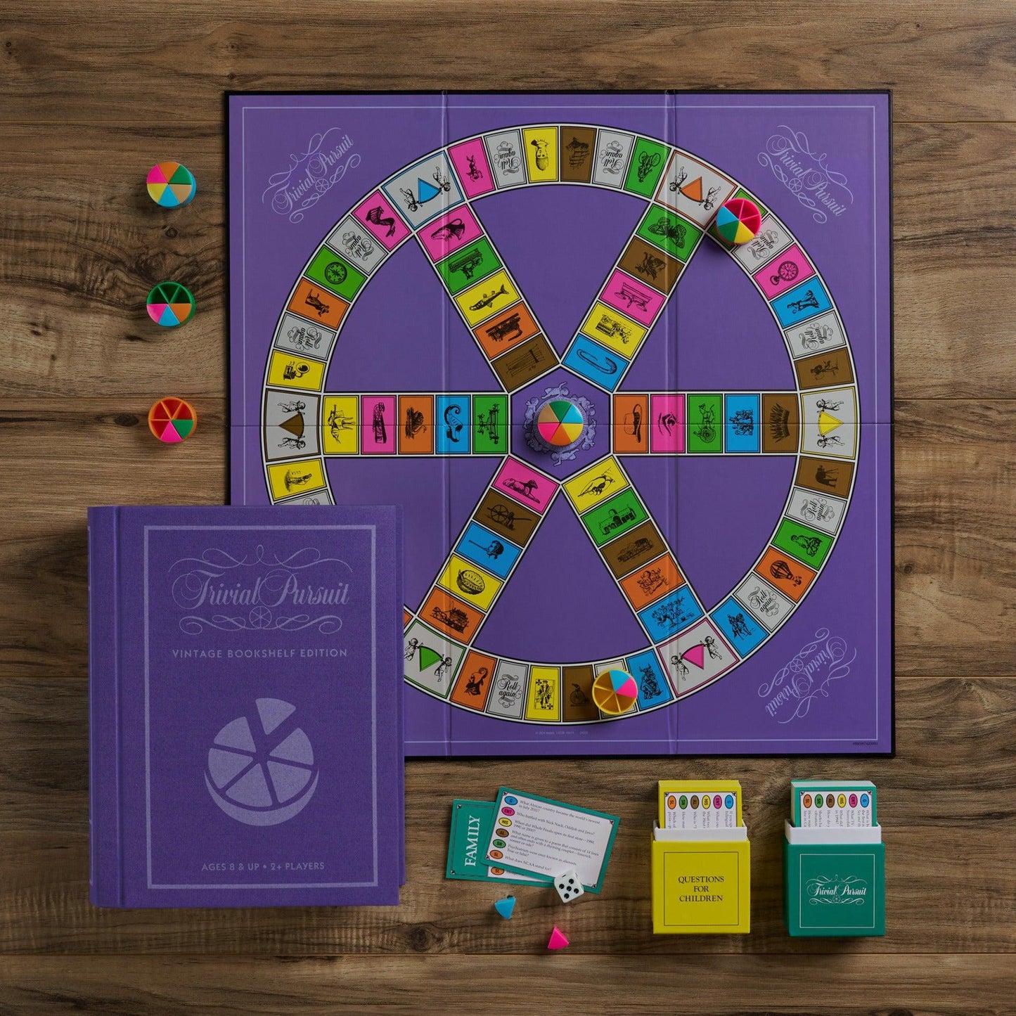 Trivial Pursuit board game on a wooden surface with components.